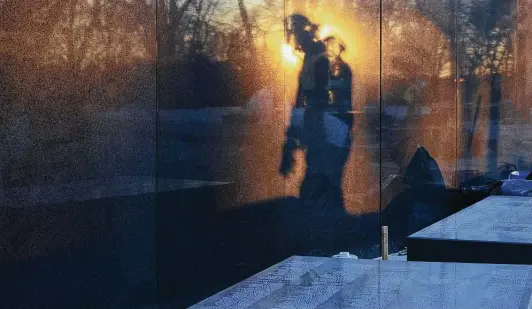  ?? Photos by Astrid Riecken / Washington Post ?? A wall with 43,000 names of the dead is being installed at the Korean War Veterans Memorial in Washington. The first seven-ton granite block was placed Monday.