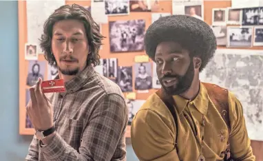  ??  ?? Flip Zimmerman (Adam Driver) and Ron Stallworth (John David Washington) infiltrate the Ku Klux Klan.