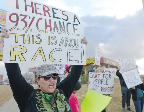  ?? MICHAEL BELL ?? Protestors hold signs at a SARM Let’s Get Real rally in April. The group is opposed to the SARM resolution that asks for more freedom for landowners to stand their ground on their properties.