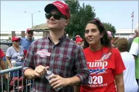  ?? ALAN FRAM — THE ASSOCIATED PRESS ?? Ashley Arentz, 28, of Jacksonvil­le, N.C., waits in line with friend Jonathan Ritter to enter a rally that President Donald Trump staged for Republican congressio­nal candidate Dan Bishop in Fayettevil­le, N.C., Monday. Arentz, a Marine, said she signed up to vote at the rally. Trump’s campaign is on the hunt for political unicorns: Trump’s team is searching for people in battlegrou­nd states who support the president but didn’t vote in 2016.