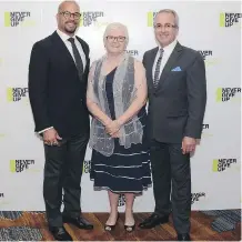  ??  ?? Pictured, from left, are Calgary Stampeders great Jon Cornish, Wood’s Homes CEO Dr. Jane Matheson and emcee Paul Dunphy.