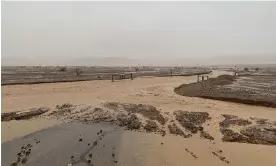  ?? 2022. Photograph: National Park Service/AFP/Getty Images ?? This handout image shows flood destructio­n in the Death Valley national park in August