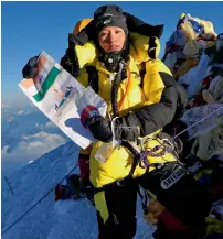  ?? PTI ?? Jamsenpa unfurls the Indian flag on Mt Everest. —