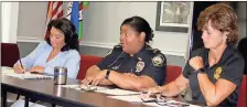  ?? / Doug Walker ?? Commission­er Evie McNiece (from left), Police Chief Denise Downer McKinney and Assistant Chief Debbie Burnett discuss Thursday plans for a 10 p.m. to 5 a.m. curfew for those under the age of 17.