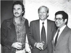  ?? RICARDO FERRO/ST. PETERSBURG TIMES ?? John Bassett, pictured here with Burt Reynolds, left, and Stephen Arky, right, once wrote that he’d have no regrets about punching Donald Trump.