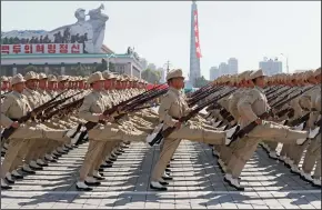  ?? ALEXANDER DEMIANCHUK/TASS/ABACA PRESS FILE PHOTOGRAPH ?? Service men march during a military parade marking the 70th anniversar­y of the foundation of North Korea in Pyongyang on Sept. 9, 2018.