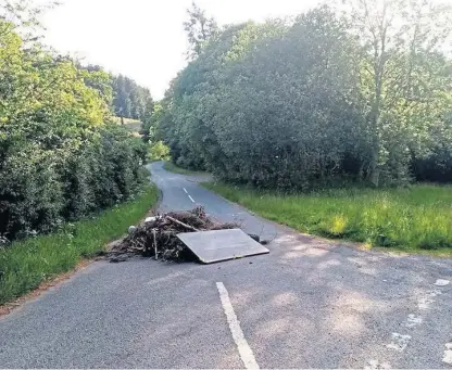  ??  ?? Perthshire man Alistair Mcnab saw the fly-tipped pile of rubbish in the road as he drove to work.
