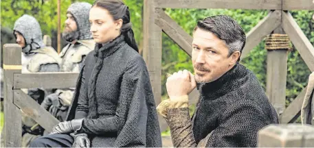  ??  ?? Killed off: Aidan Gillen, as Petyr ‘Littlefing­er’ Baelish, on the set of ‘Game of Thrones’ with Sophie Turner as Sansa Stark (left)