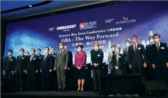  ?? EDMOND TANG / CHINA DAILY ?? Guests of honor pose for a group photo at the Greater Bay Area Conference themed “GBA: The Way Forward”, co-organized by China Daily and the Silk Road Economic Developmen­t Research Center in Hong Kong on Wednesday.