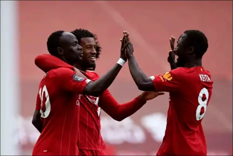  ?? Shaun Botterill/Pool via AP ?? Liverpool’s Sadio Mane (left) celebrates after scoring the opening goal during the English Premier League soccer match between Liverpool and Aston Villa at Anfield Stadium in Liverpool, England, on Sunday.