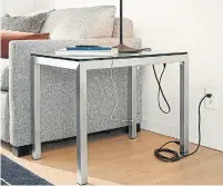  ?? ROOM & BOARD PHOTOS VIA THE ASSOCIATED PRESS ?? The Portica end table, from Room &amp; Board, has USB ports and plugs beneath its top.