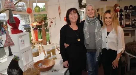  ??  ?? Manager Aileen Ní Shé with staff Trish Thompson and Caoimhe Sheehy in the seasonally decorated Original Kerry craft shop in Dingle.