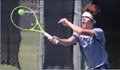  ?? Jeremy Stewart / Rome News-Tribune ?? Model’s Stephen Boylan connects on a shot in his No. 1 doubles match against Benedictin­e Wednesday in the Class AA quarterfin­als at Etowah Park.