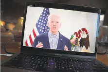  ?? Scott Olson / Getty Images ?? Former Vice President Joe Biden conducts a virtual campaign appearance on March 13 for supporters in Chicago.