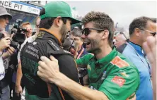  ?? Darron Cummings / Associated Press ?? Kyle Kaiser (right), of Santa Clara, celebrates with a crew member after qualifying for the Indianapol­is 500.