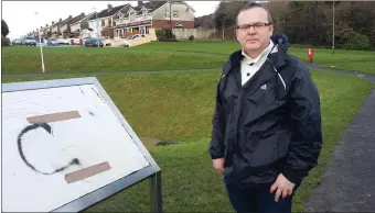  ??  ?? Cllr Flood at the Glen sign.