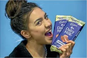  ??  ?? Reporter Brooke Bath gets stuck into the new Cadbury flavours.