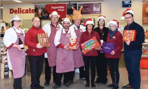  ??  ?? Derry Murphy of Murphy’s SuperValu Kenmare (right) with some of his team Sylwia Pedzisz, Trevor Scott, Richard Juozapaiti­s, Martin Godfrey, Paul Walsh, Eileen O’Sullivan, Beverley Birchley and Cliona O’Sullivan wishing all their customers a very Happy Christmas and New Year.