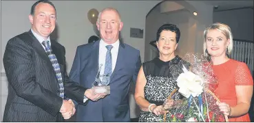 ?? (Picture: Mike English) ?? Joe Hanafin and Catriona Murphy making presentati­ons to Dermot and Theresa O’Driscoll (centre) at a function in late 2017 to honour Dermot, who retired as principal at Scoil an Athar Tadhg, Carraig na bhFear.