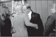  ?? AP/ Columbia Daily Tribune/ NICK SCHNELLE ?? University of Missouri System President Tim Wolfe ( right) hugs system board member Marcy Graham after announcing his resignatio­n Monday.