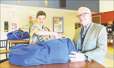  ?? Contribute­d photos ?? For his Eagle Scout project, Evan Coppa of Wethersfie­ld, at left, put together assembled duffle bags for residents of Ädelbrook in Cromwell. At right is Garry Mullaney, president and CEO.