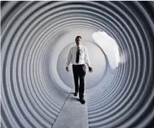  ?? Damian Dovarganes / Associated Press ?? Atlas Survival Shelters owner Ronald Hubbard in a shelter of galvanized corrugated pipe at his Los Angeles County factory.