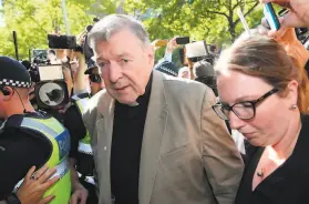  ?? Con Chronis / AFP via Getty Images 2019 ?? Cardinal George Pell (center), Pope Francis’ former finance minister, had been the most senior Catholic found guilty of sexually abusing children.