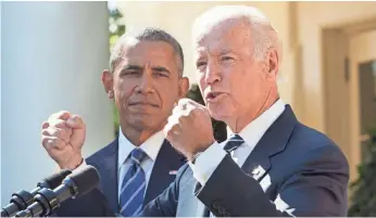  ??  ?? Vice President Biden, standing with President Obama, speaks at the White House Wednesday.
JACQUELYN MARTIN, AP