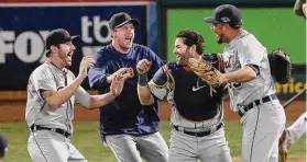  ?? Jeff Chiu/Associated Press ?? From left to right, Detroit Tigers pitcher Justin Verlander, pitcher Max Scherzer, catcher Alex Avila and pitcher Joaquin Benoit celebrate after the final out of the ninth inning of Game 5 of the American League division series against the Oakland Athletics in Oakland, Calif., in 2013.