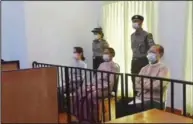  ??  ?? In this image from Myawaddy TV on Monday, a photograph shows the appearance before a special court of (seated, from left) deposed Burmese leader Aung San Suu Kyi, former President Win Myint and former Naypyitaw Council Chairman Dr. Myo Aung. (AP/Myawaddy TV)