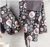  ??  ?? These winter woodland kitchen accessorie­s reflect the current popularity of florals on dark background­s.