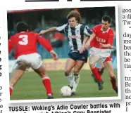  ??  ?? with TUSSLE: Woking’s Adie Cowler battles West Bromwich Albion’s Gary Bannister