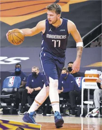  ?? (Photos: AFP) ?? Luka Doncic of the Dallas Mavericks dribbles the ball against the Phoenix Suns on Wednseady at Talking Stick Resort Arena in Phoenix, Arizona.