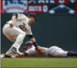  ?? BRUCE KLUCKHOHN — THE ASSOCIATED PRESS ?? Minnesota Twins second baseman Brian Dozier tags out New York Yankees Brett Gardner on an attempted stolen base in the first inning of a baseball game Wednesday in Minneapoli­s.