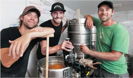  ?? BRUNO SCHLUMBERG­ER/OTTAWA CITIZEN ?? Chris Thompson, Chris Thompson — (Yes, two of them!) and James Innes are the partners in Whitewater Brewing in Foresters Falls.
