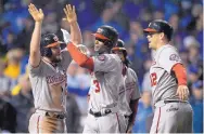  ?? JOHN MCDONNELL/THE WASHINGTON POST ?? Nationals center fielder Michael A. Taylor (3) is greeted at the plate by Daniel Murphy, Anthony Rendon and Matt Wieters after his grand slam in the eighth inning of Wednesday’s game.