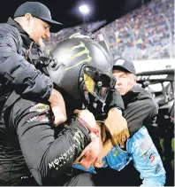  ?? MEG OLIPHANT/GETTY ?? Drivers Ty Gibbs, with helmet, and Sam Mayer get into an altercatio­n after the NASCAR Xfinity Series race Friday night in Martinsvil­le.