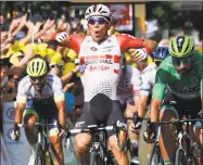  ?? Christophe Ena / Associated Press ?? Australia’s Caleb Ewan, left, celebrates as he crosses the finish line with Slovakia’s Peter Sagan to win the 16th stage of the Tour de France on Tuesday.