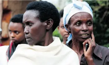  ?? Supplied ?? Vestine Mukangamij­e, left, was raped by the man who killed her husband and children. Poor, homeless and still traumatize­d, she leans on other rape survivors, like Chantal Mukeshiman­a.