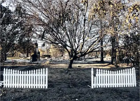  ?? Photograph­s by Genaro Molina Los Angeles Times ?? A FENCE is all that remains of Katrena and Steve Dursteler’s home in Redwood Valley. All 18 houses on their street were destroyed.