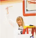  ?? ROB FOLDY ?? Lehigh women’s basketball coach Sue Troyan cuts down the net after the Mountain Hawks won their fourth Patriot League title Sunday at Boston University.