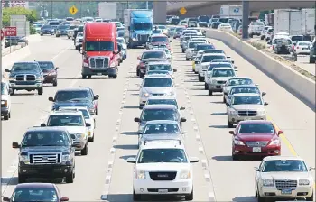  ??  ?? In this file photo, drivers work their way out of Dallas during rush hour. Motorists in parts of the country could pay a little
more for gasoline in coming days because of the shutdown of a leaking pipeline in Alabama.