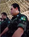  ?? The Associated Press ?? Military officers listen to testimony from Waimiri-Atroari elders on their reserve in Brazil’s Amazon state, on Feb. 27.