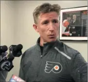  ?? ROB PARENT — DIGITAL FIRST MEDIA ?? Flyers coach Dave Hakstol speaks Monday about the sudden dismissal of general manager Ron Hextall, the man who hired him in May 2015.