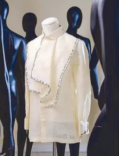  ??  ?? Diorelle Sy created a piña barong as a David Bowie tribute featuring a jabot with Bowie’s portrait at the back, lyrics and other details hand-embroidere­d by Sy herself.