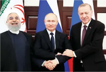  ?? — Reuters photo ?? Rouhani, Putin and Erdogan meet in the Black Sea resort of Sochi, Russia.