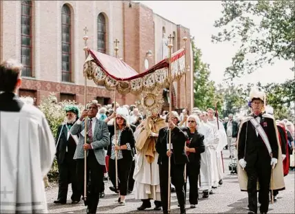  ?? Albany Roman Catholic Diocese ?? A 2018 Eucharisti­c Procession during the Eucharisti­c Congress at Our Lady of Martyrs Shrine in Auriesvill­e.