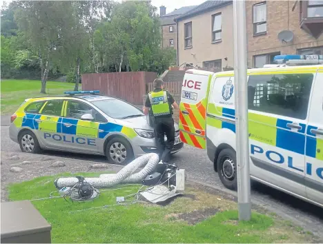  ??  ?? Police officers at the address on Callender Gardens.