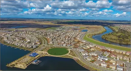  ??  ?? River Islands in Lathrop is a 5,000-acre master-planned community, with homes, lakes, parks, trails, schools and a restaurant. A business park and retail Town Center are now in the planning.