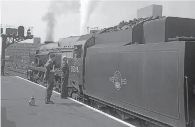  ??  ?? A top link man of steam days: Salisbury driver Percy Young with No. 35018 on the ‘Atlantic Coast Express' at Waterloo on July 17, 1962. DON BENN